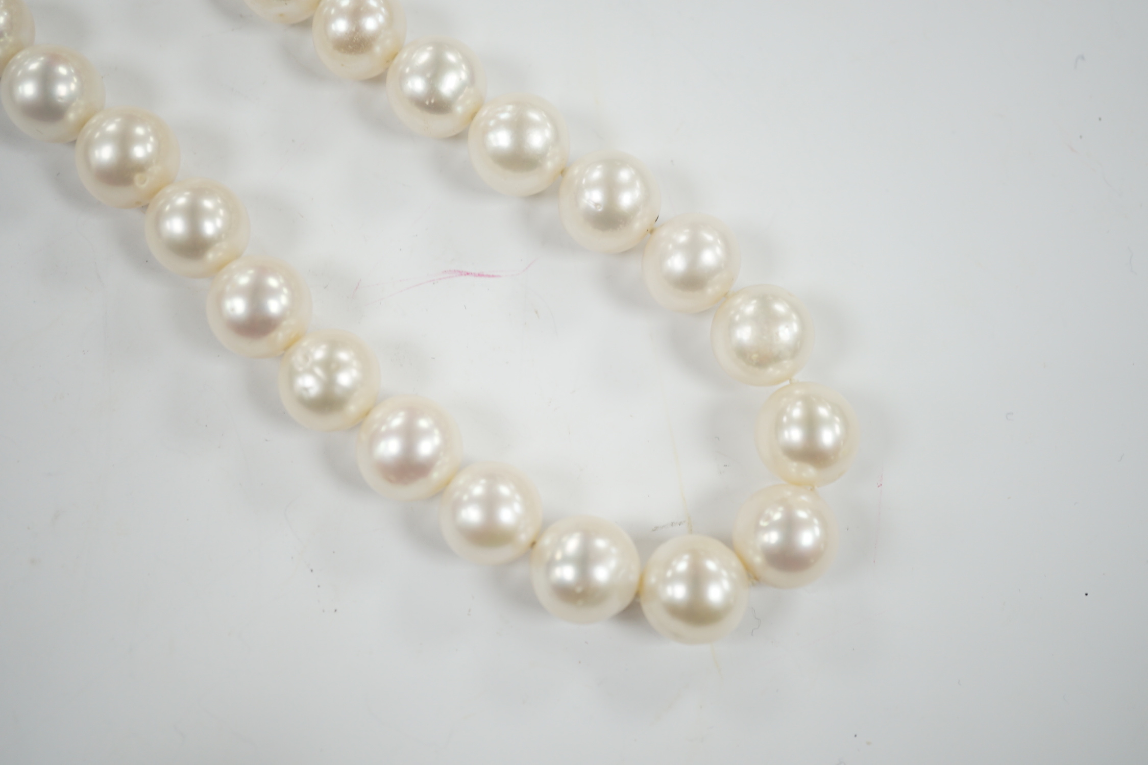 A Butler & Wilson single strand cultured pearl necklace, with enamelled and gem set bug clasp, 43cm.